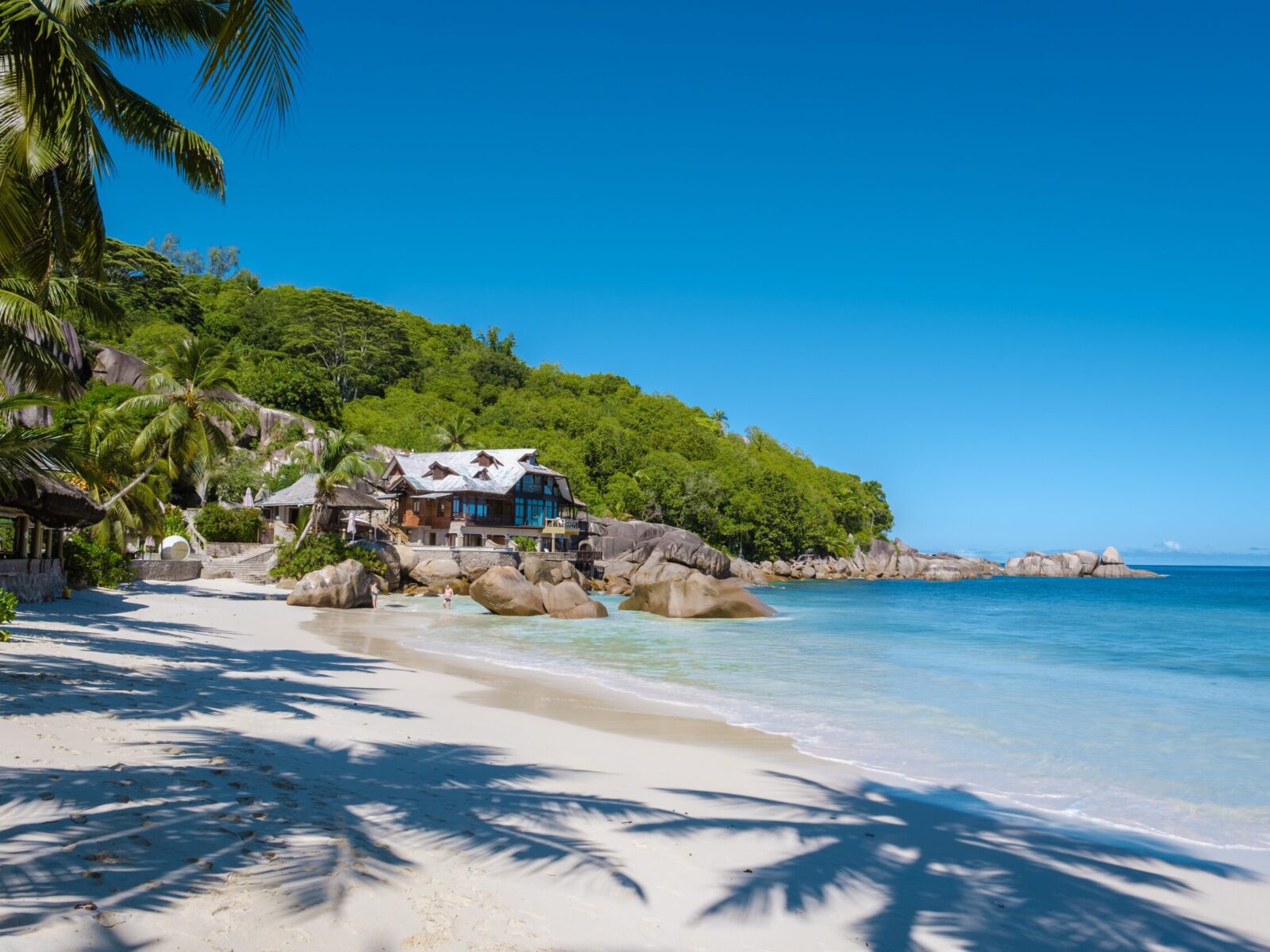 Mahe,Seychelles,,A,Tropical,Beach,With,Palm,Trees,,And,A