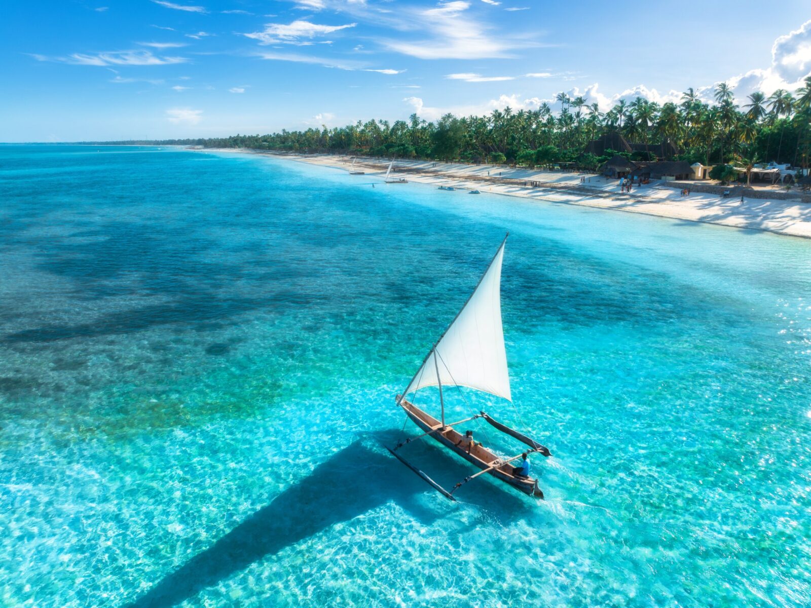 Aerial,View,Of,The,Sailboat,On,Blue,Sea,,Empty,White