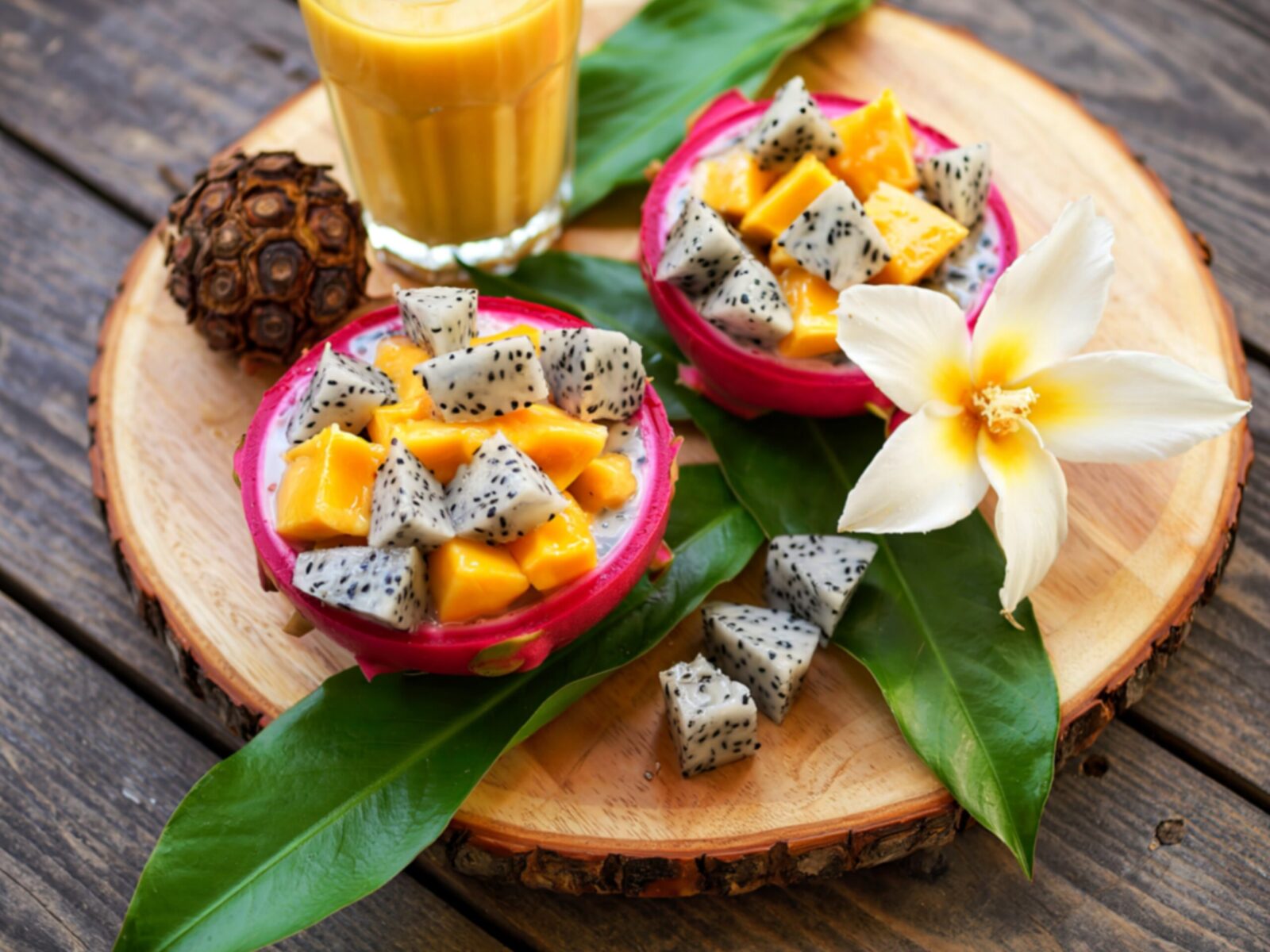 Two,Dragon,Fruit,Halves,Are,Filled,With,Diced,Mango,And